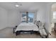 Bedroom featuring bright window, ceiling fan and a comfortable bed with throw pillows at 17838 E 54 Th Ave, Denver, CO 80249