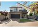 Charming two-story home featuring neutral tones, modern architectural detail, and a brick driveway at 17838 E 54 Th Ave, Denver, CO 80249