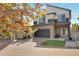 Charming two-story home featuring neutral tones, modern architectural detail, and a brick driveway at 17838 E 54 Th Ave, Denver, CO 80249