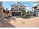A charming two-story home featuring neutral tones, a black garage door, and a lovely brick driveway at 17838 E 54 Th Ave, Denver, CO 80249