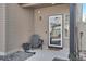 Inviting front porch featuring neutral tones, a glass door, and a Hello door mat at 17838 E 54 Th Ave, Denver, CO 80249