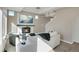 Bright open-concept living room featuring a wall-mounted fireplace and tv at 17838 E 54 Th Ave, Denver, CO 80249