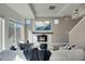 Bright open-concept living room featuring a wall-mounted fireplace and tv at 17838 E 54 Th Ave, Denver, CO 80249