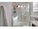 Modern bathroom shower with bright tiles, a glass enclosure, and a shower head, providing a luxurious bathing experience at 17838 E 54 Th Ave, Denver, CO 80249