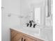 Modern bathroom with a marble countertop and black fixtures at 1035 Jasmine St # 3, Denver, CO 80220