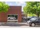 Brick commercial building with storefront and ample parking at 1035 Jasmine St # 3, Denver, CO 80220