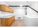 Laundry area with washer, dryer, and wooden cabinets at 1035 Jasmine St # 3, Denver, CO 80220