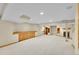 Large basement with built-in cabinets, fireplace and ample space for entertaining at 2316 Weatherstone Cir, Highlands Ranch, CO 80126