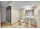 Basement bathroom with glass shower enclosure, pedestal sink and earth-toned tile floors at 2316 Weatherstone Cir, Highlands Ranch, CO 80126
