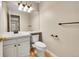 Well-lit half bathroom with modern fixtures and a sleek vanity at 2316 Weatherstone Cir, Highlands Ranch, CO 80126