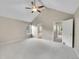 Bedroom featuring vaulted ceilings and neutral walls leading to bathroom and hallway at 2316 Weatherstone Cir, Highlands Ranch, CO 80126