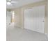 Bedroom with neutral walls, carpet flooring, and double closet for storage at 2316 Weatherstone Cir, Highlands Ranch, CO 80126