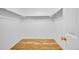 Walk-in closet with wood floor and built-in shelving for optimal storage at 2316 Weatherstone Cir, Highlands Ranch, CO 80126