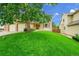 Exterior view of the home showcasing a spacious front yard and well-maintained lawn at 2316 Weatherstone Cir, Highlands Ranch, CO 80126