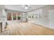 Open concept living area with hardwood floors, bright windows, and backyard access at 2316 Weatherstone Cir, Highlands Ranch, CO 80126