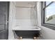 Classic bathroom with clawfoot tub, subway tile, and vintage-inspired fixtures at 3055 N York St, Denver, CO 80205