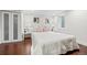 Bright bedroom features hardwood floors, recessed lighting, and stylish decor at 3055 N York St, Denver, CO 80205