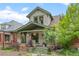Charming two-story home featuring beautiful front porch and well-maintained landscaping at 3055 N York St, Denver, CO 80205