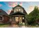 Charming two-story home featuring beautiful front porch and well-maintained landscaping at 3055 N York St, Denver, CO 80205