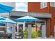 Rivers and Roads Coffee shop front with blue umbrellas and a modern exterior at 3055 N York St, Denver, CO 80205