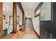 Charming foyer with hardwood floors and staircase with decorative wood columns at 3055 N York St, Denver, CO 80205