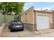 A single car garage with a rear parking spot at 3055 N York St, Denver, CO 80205