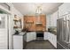 Modern kitchen with stainless steel appliances, exposed brick and ample counter space at 3055 N York St, Denver, CO 80205