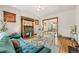 Bright living room with hardwood floors, fireplace, and large windows at 3055 N York St, Denver, CO 80205
