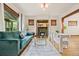 Bright living room with hardwood floors, fireplace, and large windows at 3055 N York St, Denver, CO 80205