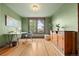 Inviting home office with hardwood floors, a large window, and charming wood accents at 3055 N York St, Denver, CO 80205