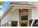 A modern building with 'The Plimoth' sign, stylishly designed for business at 3055 N York St, Denver, CO 80205