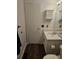 Functional bathroom with a white vanity, medicine cabinet, and a toilet at 84 S Carlton St, Castle Rock, CO 80104