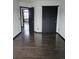 Spacious bedroom with dark hardwood floors and double closets at 84 S Carlton St, Castle Rock, CO 80104