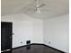 Simple bedroom with dark floors and ceiling fan at 84 S Carlton St, Castle Rock, CO 80104