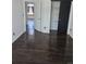 Bright bedroom featuring wood floors, white walls, and a closet with a sliding door at 84 S Carlton St, Castle Rock, CO 80104