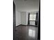 Bright bedroom with dark wood floors and large window at 84 S Carlton St, Castle Rock, CO 80104