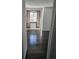 Bright bedroom showcasing dark hardwood floors and a window with brown curtains at 84 S Carlton St, Castle Rock, CO 80104