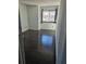 Cozy bedroom featuring dark hardwood floors and a window with black curtains at 84 S Carlton St, Castle Rock, CO 80104