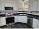 Kitchen with stainless steel appliances and dark countertops at 84 S Carlton St, Castle Rock, CO 80104