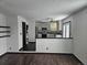 Open concept kitchen with island and stainless steel appliances at 84 S Carlton St, Castle Rock, CO 80104