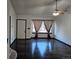 Spacious living room with dark hardwood floors and a large window at 84 S Carlton St, Castle Rock, CO 80104