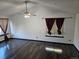 Living room featuring dark hardwood floors, high ceilings, and ceiling fan at 84 S Carlton St, Castle Rock, CO 80104