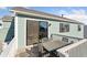 Back deck with seating and sliding glass door at 1030 W Hopkins Dr, Elizabeth, CO 80107