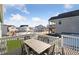 Back deck with seating and neighborhood view at 1030 W Hopkins Dr, Elizabeth, CO 80107