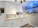 Basement wet bar with white cabinets and shelving at 1030 W Hopkins Dr, Elizabeth, CO 80107