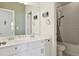 Main bathroom with double sinks and shower/tub combo at 1030 W Hopkins Dr, Elizabeth, CO 80107