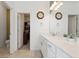 Well-lit bathroom with a quartz countertop, modern fixtures, and walk-in closet at 1030 W Hopkins Dr, Elizabeth, CO 80107