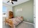 Charming bedroom with wood bed frame and green accent wall at 1030 W Hopkins Dr, Elizabeth, CO 80107