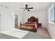 Spacious bedroom with a large bed and ceiling fan at 1030 W Hopkins Dr, Elizabeth, CO 80107