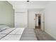 Basement bedroom with gray carpeting and an accent wall at 1030 W Hopkins Dr, Elizabeth, CO 80107